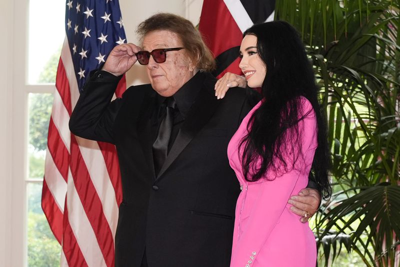 Don McLean and Paris Dunn arrive at the Booksellers area of the White House for the State Dinner hosted by President Joe Biden and first lady Jill Biden for Kenya's President William Ruto and Kenya's first lady Rachel Ruto, Thursday, May 23, 2024, in Washington. (AP Photo/Jacquelyn Martin)