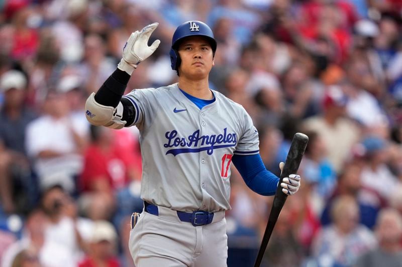 Los Angeles Dodgers' Shohei Ohtani reacts after a strike against Philadelphia Phillies pitcher Aaron Nola during the fifth inning of a baseball game, Thursday, July 11, 2024, in Philadelphia. (AP Photo/Matt Slocum)