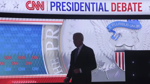 President Joe Biden walks back on stage after a commercial break debating former President Donald Trump at CNN, Thursday, June 27, 2024, in Atlanta. (Jason Getz / AJC)