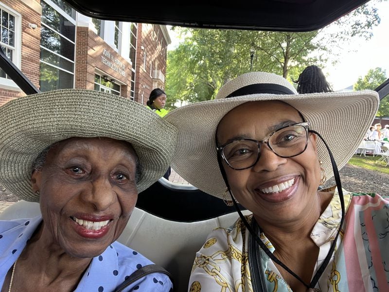 Margaret Jacobs and friend Janice Harris share a golf cart ride. Courtesy of Janice Harris