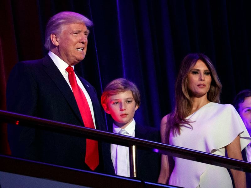 FILE - President-elect Donald Trump, left, arrives to speak at an election night rally with his son Barron and wife Melania, in New York, Nov. 9, 2016. (AP Photo/Evan Vucci, File)