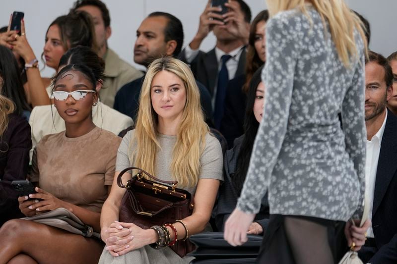 Normani, left, and Shailene Woodley attend the Fendi Spring Summer 2025 collection, that was presented in Milan, Italy, Tuesday, Sept. 17, 2024. (AP Photo/Luca Bruno).