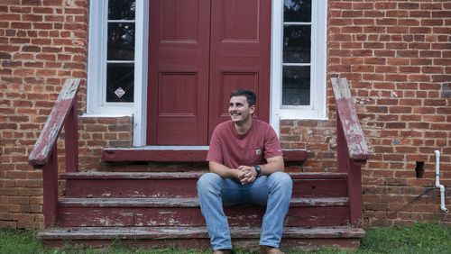 Army veteran Edward Robertson poses for a portrait in downtown Homer, at the Old Courthouse on Oct. 1, 2024. (Olivia Bowdoin for the AJC).