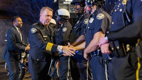 New Atlanta police Chief Darin Schierbaum greets officers before his swearing-in ceremony at Atlanta City Hall on Dec. 7. He is the city’s 26th chief of police.