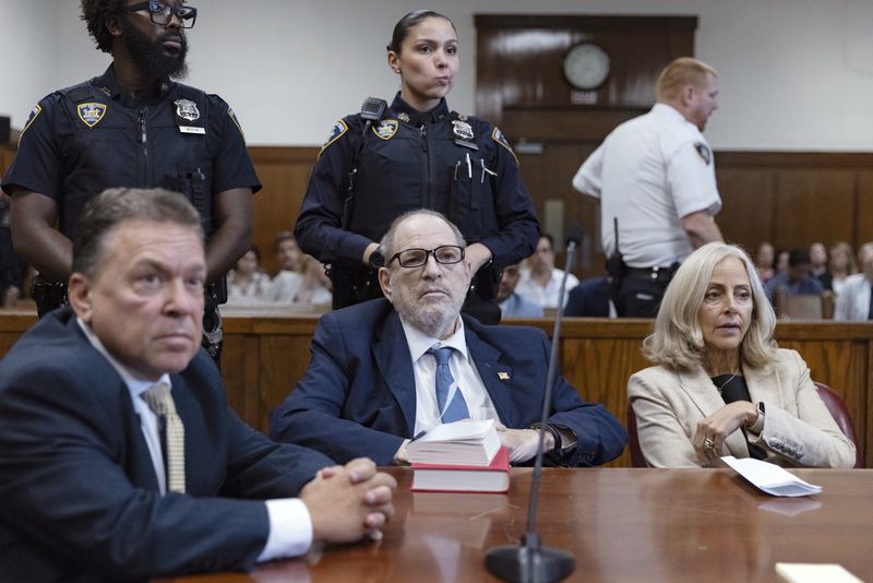 Harvey Weinstein, center, appears in criminal court in New York, Wednesday, Sept. 18, 2024. (Jeenah Moon/Pool Photo via AP)