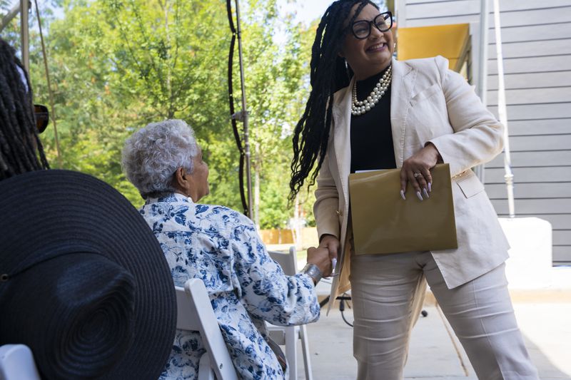 U.S. Rep. Nikema Williams (right), an Atlanta Democrat, is holding a news conference today. She is pictured shaking hands with former Atlanta Mayor Shirley Franklin. 