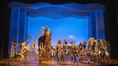 At the climax of “Circle of Life,” the opening of “The Lion King,” the cast is gathered onstage. That includes former Atlantan Courtney Thomas, walking on stilts to play one of the 14-foot-tall giraffes. (Photo by Matthew Murphy)