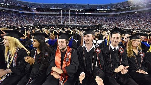 May 10, 2019 Athens - Students react as they listen to commencement speaker Deborah Ann Roberts, news correspondent, during UGA's 2019 spring undergraduate commencement ceremony at Sanford Stadium in Athens on Friday, May 10, 2019. HYOSUB SHIN / HSHIN@AJC.COM