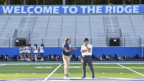 Norcross head coach Keith Maloof, left, and Peachtree Ridge head coach meet at midfield before the GHSA region football game on Friday, Sept. 20, 2024, in Suwanee, GA. (Jim Blackburn for the Atlanta Journal-Constitution)