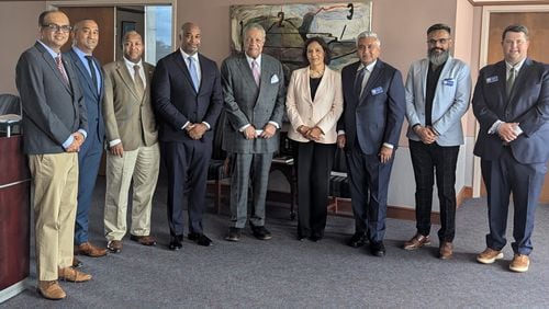 From left to right: Georgia Indo-American Chamber of Commerce (GIACC) board members Amber Mehta and SK Raj; College Park Councilmember Joe Carn; Development Authority of Fulton County Chair Kwanza Hall; Fulton County Commission Chair Robb Pitts; GIACC Chair Grace Multani; GIACC President Jay Joshi; GIACC board member Nick Patel and GIACC secretary Daniel Preston outside of Pitts' office on Thursday, September 19, 2024. Pitts is part of a delegation of Fulton County officials traveling to India in October.