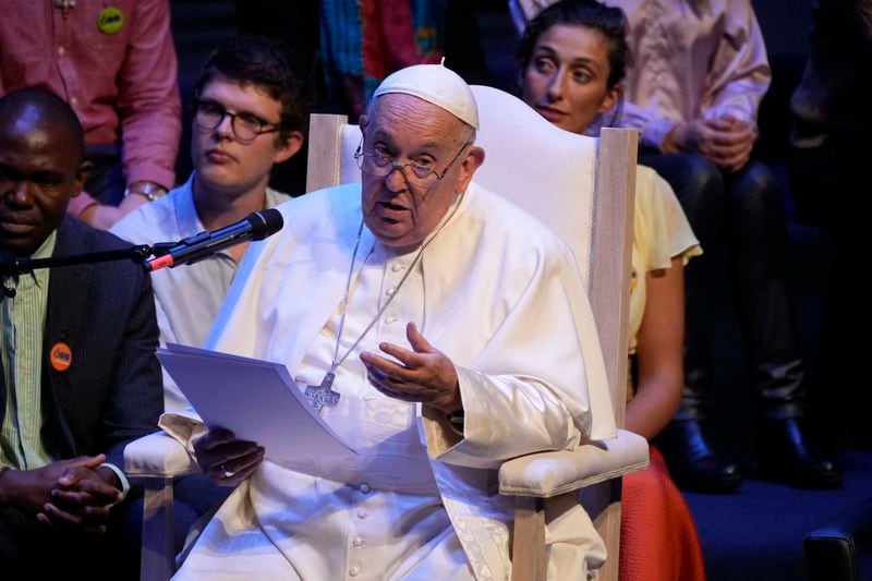 Pope Francis delivers his message as he meets with students in the Aula Magna of the Leuvain Catholic University, Saturday, Sept. 28, 2024. (AP Photo/Andrew Medichini)