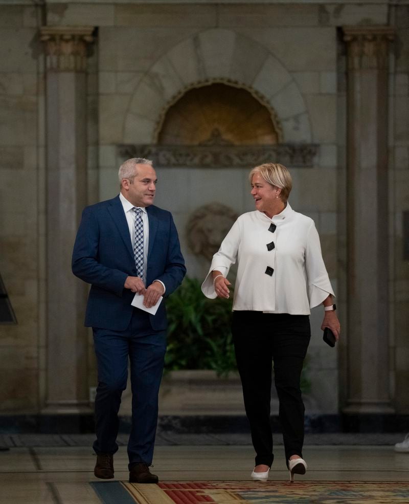 Fairmont Chateau Laurier General Manager Genevieve Dumas, right, speaks with Ottawa Police Services Detective Akiva Gellar as they make their way to a news conference to speak about the stolen Yousuf Karsh portrait of Winston Churchill, during a news conference in the hotel in Ottawa, Canada, Wednesday, Sept. 11, 2024. (Adrian Wyld/The Canadian Press via AP)