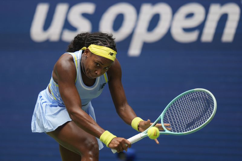 Coco Gauff, of the United States, returns a shot to Elina Svitolina, of Ukraine, during the third round of the U.S. Open tennis championships, Friday, Aug. 30, 2024, in New York. (AP Photo/Seth Wenig)