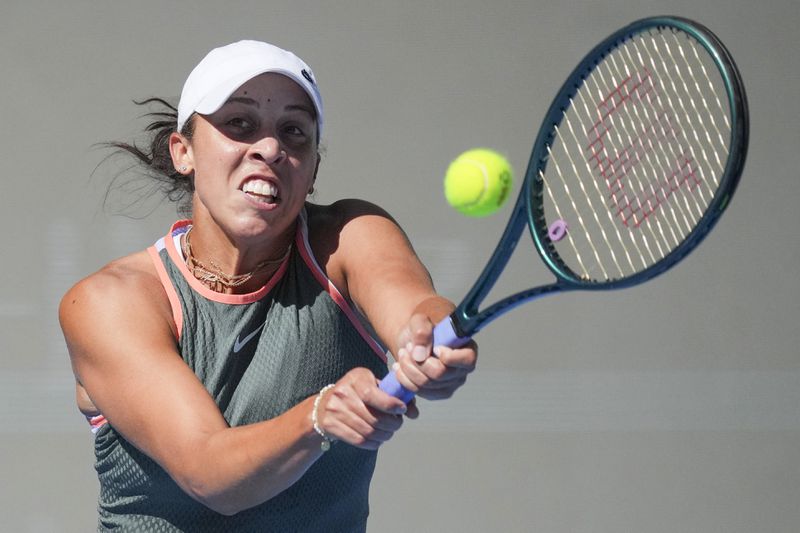 Madison Keys of the United States returns a shot from Aryna Sabalenka of Belarus during their women's singles match of the China Open tennis tournament, at the National Tennis Center in Beijing, Wednesday, Oct. 2, 2024. (AP Photo/Achmad Ibrahim)