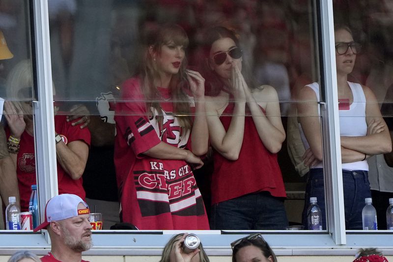 Taylor Swift is seen in a suite during the first half of an NFL football game between the Kansas City Chiefs and the Cincinnati Bengals Sunday, Sept. 15, 2024, in Kansas City, Mo. (AP Photo/Charlie Riedel)