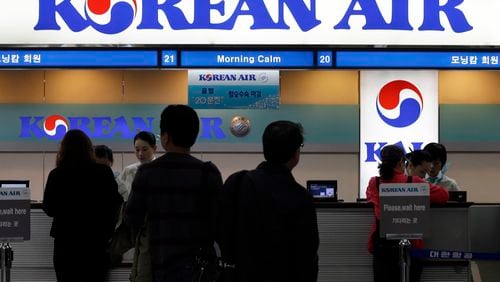 FILE - Passengers approach a Korean Air counter at Gimpo airport in Seoul, South Korea, Oct. 25, 2012. Cups of Shin Ramyun instant noodles, which have become a fan favorite among Korean Air travelers over the years, will no longer be available for Economy class passengers starting August 15, 2024, a spokesperson for the Seoul-based airline confirmed. (AP Photo/Lee Jin-man, File)