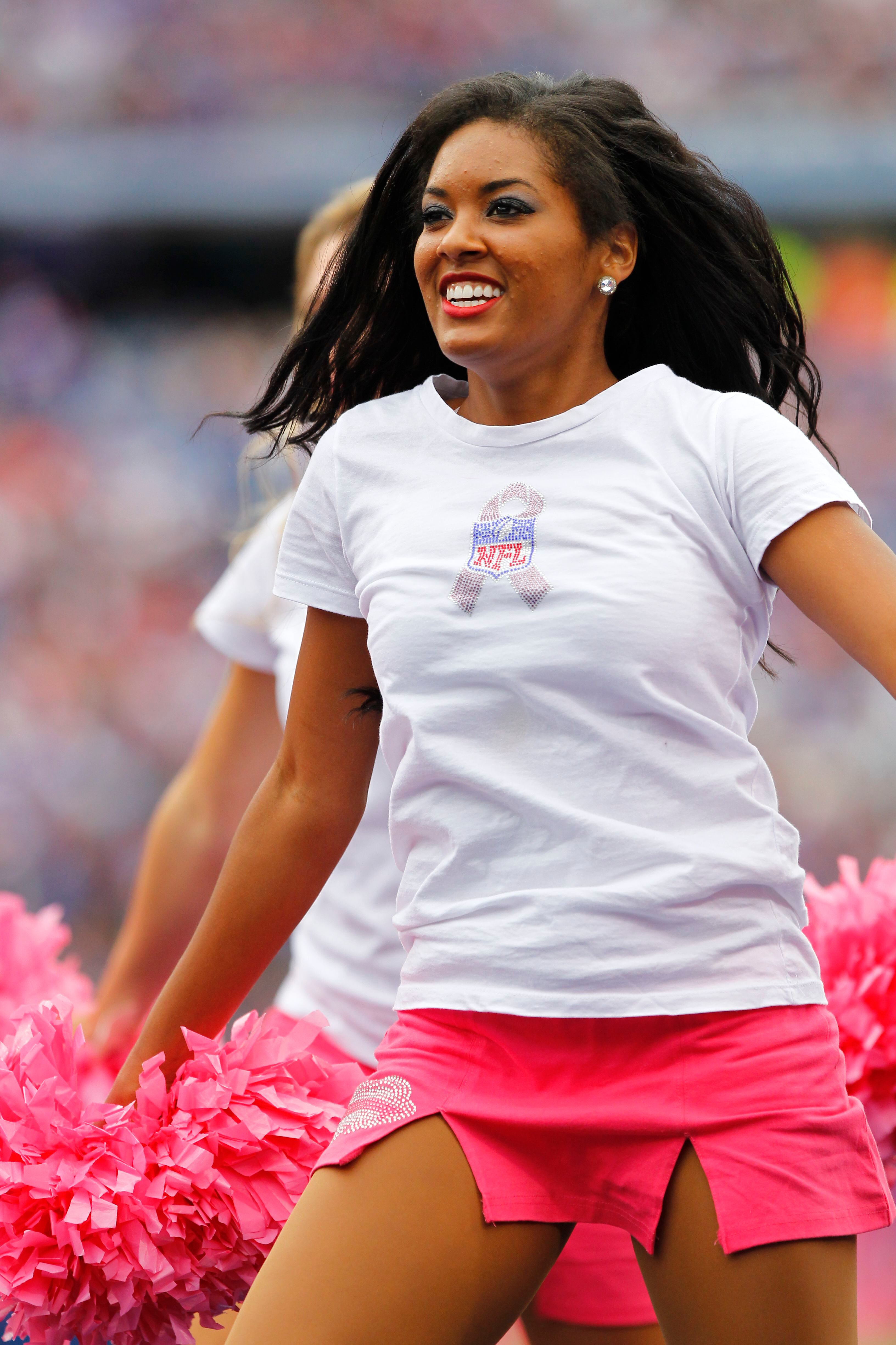 Seattle Seahawks cheerleaders pink pom,poms awareness.