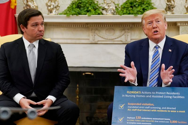 FILE - President Donald Trump speaks during a meeting with Gov. Ron DeSantis, R-Fla., in the Oval Office of the White House, April 28, 2020, in Washington. Trump and DeSantis are signaling to donors that they're putting their rivalry behind them. DeSantis has convened his allies this week in Fort Lauderdale, Fla., to press them to support Trump. He argued to them Wednesday, May 22, 2024, that they need to work together to prevent President Joe Biden from winning a second term. (AP Photo/Evan Vucci, File)
