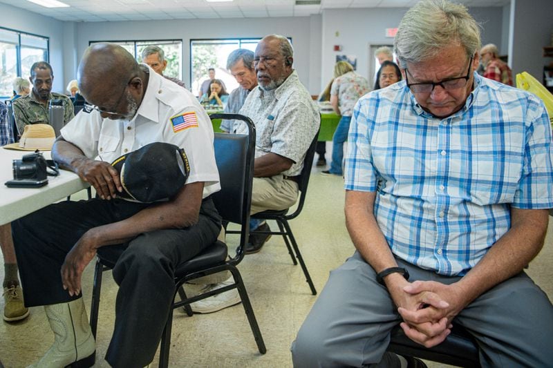 Participants take a moment to mourn the victim during the Lemuel Penn remembrance ceremony in Madison County on Thursday, July 11, 2024.  (Ziyu Julian Zhu / AJC)