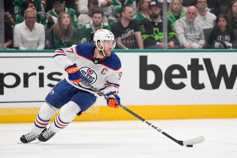 Edmonton Oilers center Connor McDavid controls the puck during the first period in Game 2 of the team's Western Conference finals against the Dallas Stars in the NHL hockey Stanley Cup playoffs Saturday, May 25, 2024, in Dallas. (AP Photo/Tony Gutierrez)