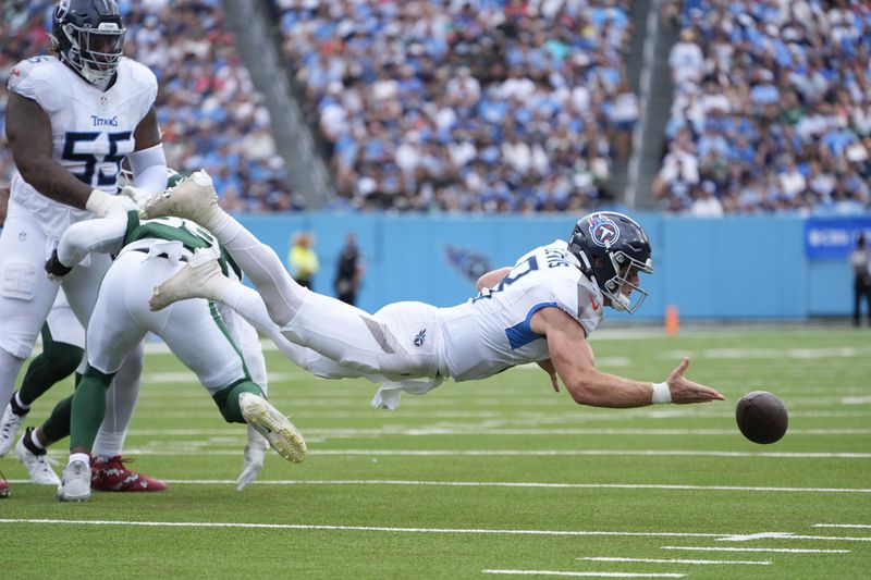 Tennessee Titans quarterback Will Levis (8) fumbles the ball in the first half of an NFL football game against the New York Jets in Nashville, Tenn., on Sunday, Sept. 15, 2024. (AP Photo/George Walker IV)