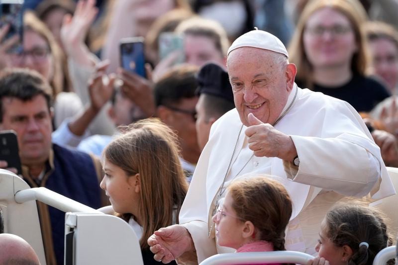 Pope Francis gives his thumbs up as he arrives for his weekly general audience in St. Peter's Square, at the Vatican, Wednesday, Sept. 18, 2024. (AP Photo/Andrew Medichini)