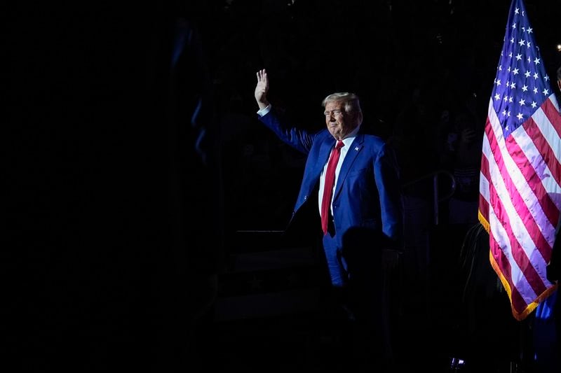 Republican presidential candidate former President Donald Trump waves to supporters as he arrives for a town hall event at the Dort Financial Center, Tuesday, Sept. 17, 2024, in Flint, Mich. (AP Photo/Evan Vucci)