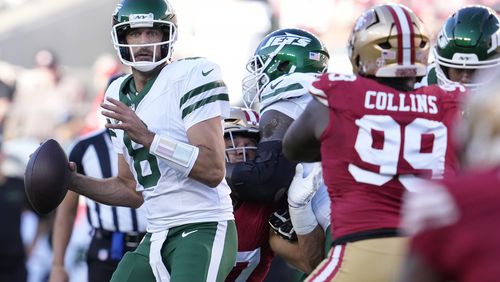 New York Jets quarterback Aaron Rodgers (8) looks to pass the ball during the first half of an NFL football game against the San Francisco 49ers in Santa Clara, Calif., Monday, Sept. 9, 2024. (AP Photo/Godofredo A. Vásquez)