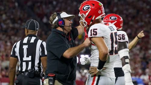 Georgia head coach Kirby Smart talks with Georgia quarterback Carson Beck (15) after Beck threw his second interception during the second quarter against Alabama at Bryant-Denny Stadium, Saturday, Sept. 28, 2024, in Tuscaloosa, Al. (Jason Getz / AJC)

