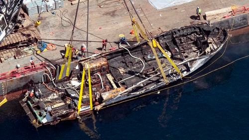 FILE - The burned hull of the dive boat Conception is brought to the surface by a salvage team off Santa Cruz Island, Calif., on Sept. 12, 2019. Conception's captain Jerry Boylan was ordered Wednesday, July 31, 2024, to pay restitution to the families of 34 people killed in a fire aboard the vessel in 2019. (Brian van der Brug/Los Angeles Times via AP, File)