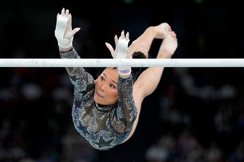 FILE - Sunisa Lee, of United States, competes on the uneven bars during a women's artistic gymnastics qualification round at Bercy Arena at the 2024 Summer Olympics, Sunday, July 28, 2024, in Paris, France. (AP Photo/Abbie Parr, File)