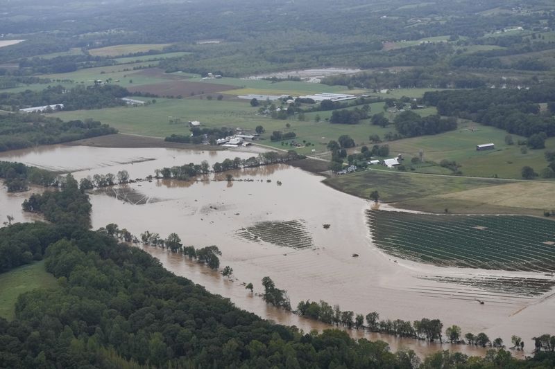 An aerial view of flood damage left by Hurricane Helene along the Nolichucky River, Saturday, Sept. 28, 2024, in Greene County, Tenn. (AP Photo/George Walker IV)