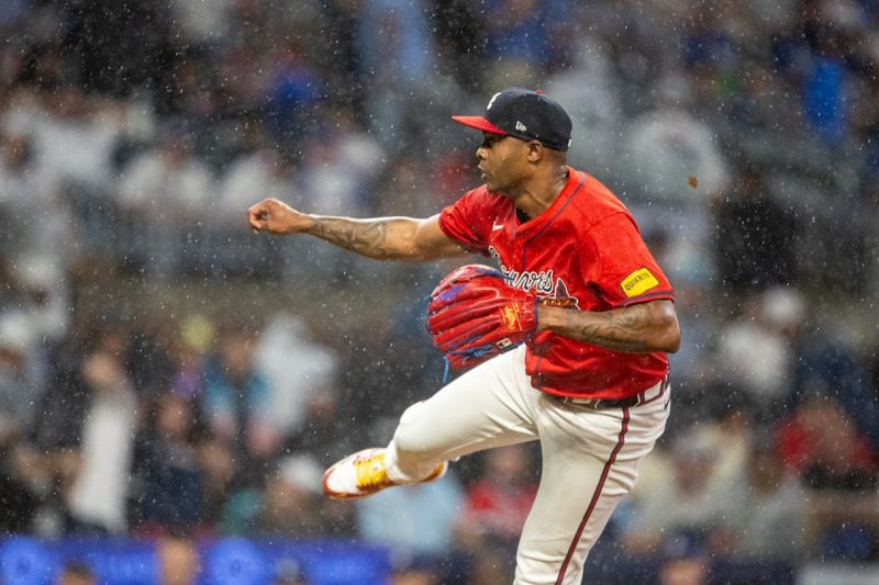 Atlanta Braves pitcher Raisel Iglesias (26) pitches in the ninth inning against the Los Angeles Dodgers at Truist Park in Atlanta on Friday, September 13, 2024. (Arvin Temkar / AJC)