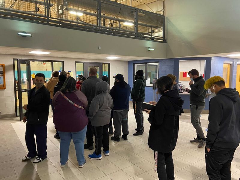 Roughly two dozens voters lined up at Best Friend Park in Norcross around 6:45 a.m.