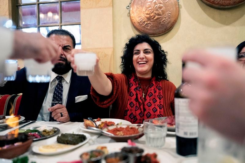 Sophia Armen, offers a toast to her colleagues, members of the Armenian-American Census Coalition at the Carousel a Lebanese-Armenian restaurant in Glendale, Calif. on Friday, May 17, 2024. For some race and ethnic groups, how the U.S. government categorizes them for crucial surveys and the once-a-decade census is still falling short. Hmong as well as Armenian, Arab American and Brazilian communities say they feel excluded or diminished when it comes to how they are counted in their own country. (AP Photo/Richard Vogel)