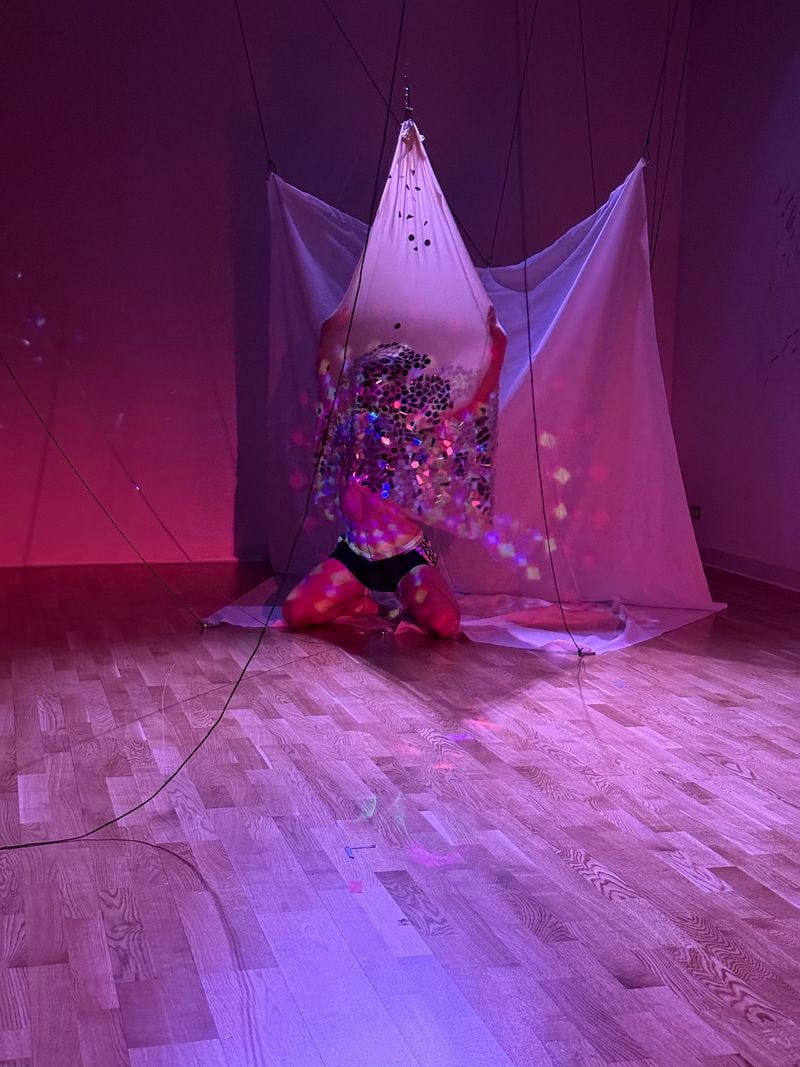 For “Red Tethers,” Atlanta artist Jimmy Joyner uses fabric and disco ball mirrors to create a mood.
