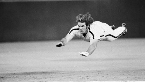 FILE - Philadelphia Phillies' Pete Rose slides to third base during a baseball game against the New York Mets in Philadelphia, June 3, 1981. (AP Photo/Rusty Kennedy, File)