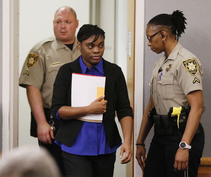  Tiffany Moss arrives in court for the first day of her death penalty trial on April 24, 2019.  Moss, who is representing herself, declined to make an opening statement.