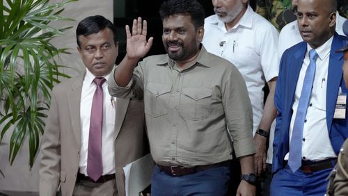 Marxist lawmaker Anura Kumara Dissanayake waves as he departs the election commission office after winning the presidential election in Colombo, Sri Lanka, Sunday, Sept. 22, 2024. (AP Photo/Eranga Jayawardena)