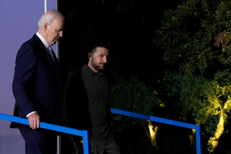 U.S. President Joe Biden, left, and Ukraine's President Volodymyr Zelenskyy leave after they signed a bilateral security agreement during the sidelines of the G7 summit at Savelletri, Italy, Thursday, June 13, 2024. (AP Photo/Andrew Medichini)