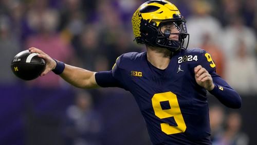 Michigan quarterback J.J. McCarthy passes against Washington during the first half of the national championship NCAA College Football Playoff game Monday, Jan. 8, 2024, in Houston. (AP Photo/Godofredo A. Vasquez)