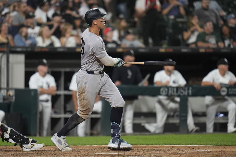 New York Yankees designated hitter Aaron Judge hits his 300th career home run, the fastest playing in MLB history to do so, during the eighth inning of a baseball game against the Chicago White Sox, Wednesday, Aug. 14, 2024, in Chicago. (AP Photo/Erin Hooley)