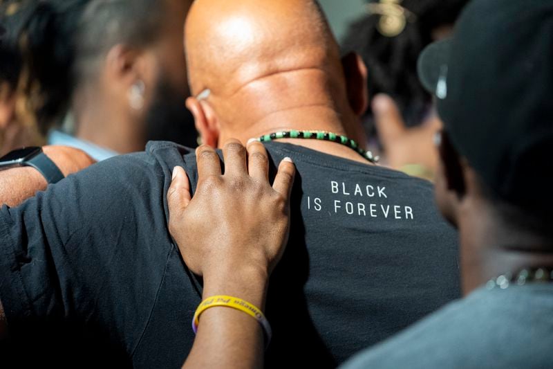 Attendees gather and pray during a Black Man Lab meeting to discuss the candidacy of Vice President Kamala Harris, Monday, July 22, 2024, in Atlanta. (AP Photo/Stephanie Scarbrough)