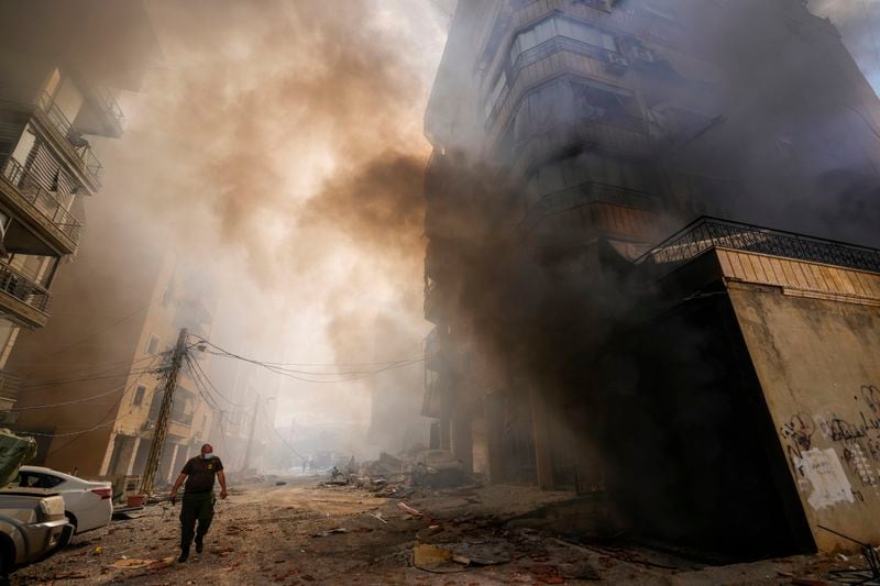 Smoke rises from the site of an Israeli airstrike in Dahiyeh, Beirut, Lebanon, Wednesday, Oct. 2, 2024. (AP Photo/Hassan Ammar)