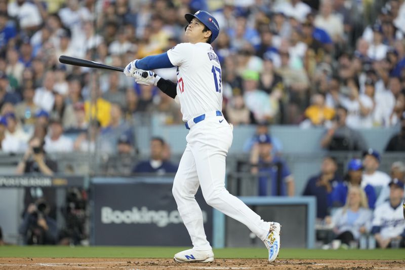 Los Angeles Dodgers' Shohei Ohtani flies out against the San Diego Padres during the first inning in Game 1 of baseball's NL Division Series Saturday, Oct. 5, 2024, in Los Angeles. (AP Photo/Ashley Landis)