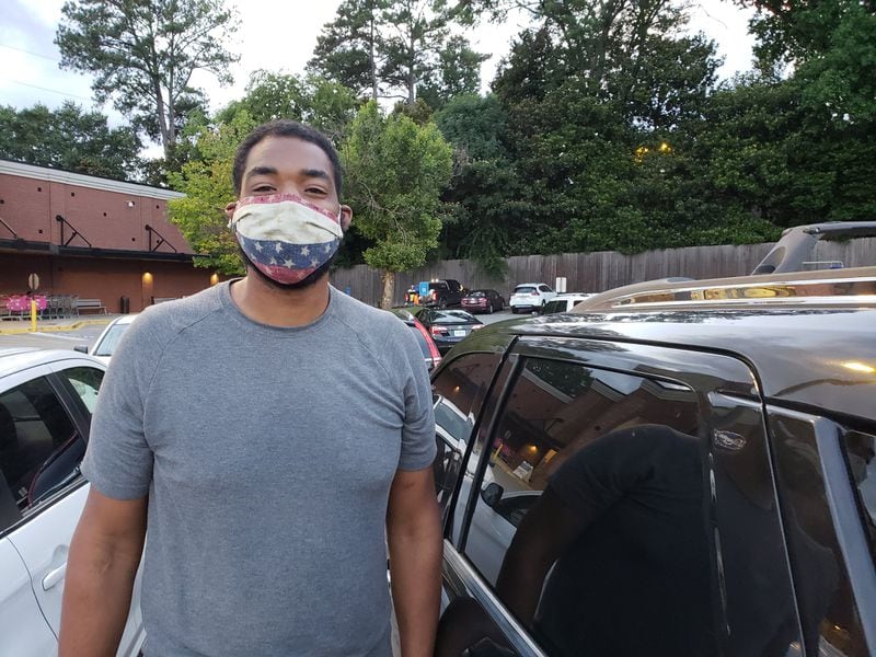 Walter Stith, a financial adviser in Atlanta and a former NFL player, said he wears a mask to protect loved ones and others from the coronavirus. With the number of coronavirus cases in Georgia spiking, he said he thinks mandatory mask requirements have become necessary. MATT KEMPNER / AJC