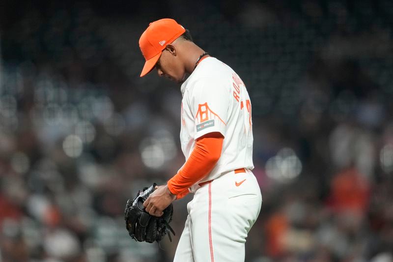 San Francisco Giants pitcher Randy Rodríguez walks toward the dugout during the 10th inning of a baseball game against the Atlanta Braves in San Francisco, Tuesday, Aug. 13, 2024. (AP Photo/Jeff Chiu)