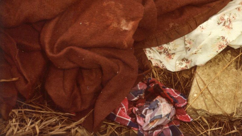 Pictured are the blanket, sheet and shirt found in the ditch where a newborn boy, his umbilical cord and placenta still attached to his body, was found frozen to death Feb. 28, 1981, in Sioux Falls, South Dakota. After more than 38 years, cold case detectives on Friday, March 8, 2019, arrested the baby's mother, Theresa Josten Bentaas, now 57, and charged her with murder in his death. Bentaas, who was 19 when she gave birth, was identified through genealogy databases and DNA taken from the baby's exhumed body a decade ago.