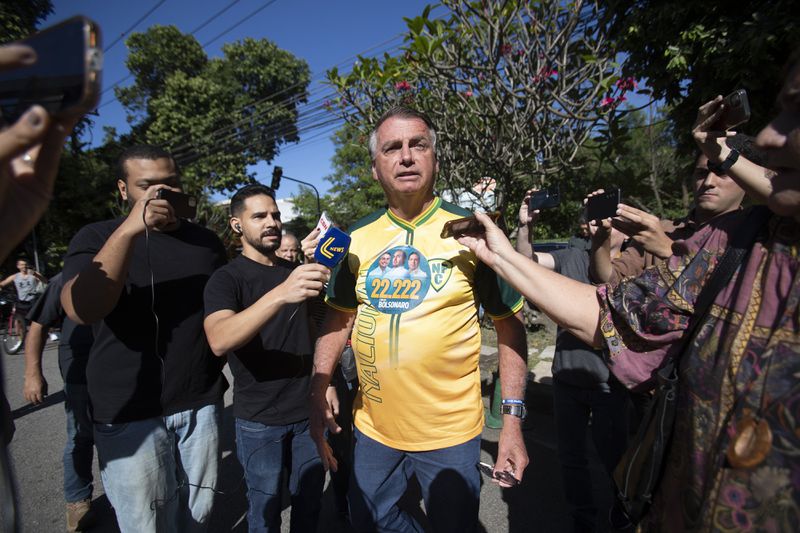 Former President Jair Bolsonaro campaigns for Rio de Janeiro mayoral candidate Alexandre Ramagem, not pictured, of the Liberal Party, during municipal elections in Rio de Janeiro, Sunday, Oct. 6, 2024. (AP Photo/Bruna Prado)