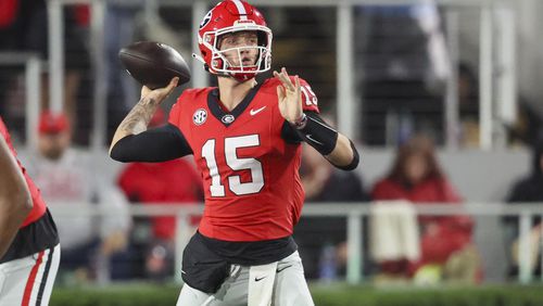 Georgia quarterback Carson Beck (15) attempts a pass during their game against Ole Miss at Sanford Stadium, Saturday, November 11, 2023, in Athens, Ga. Georgia won 52-17. (Jason Getz / Jason.Getz@ajc.com)